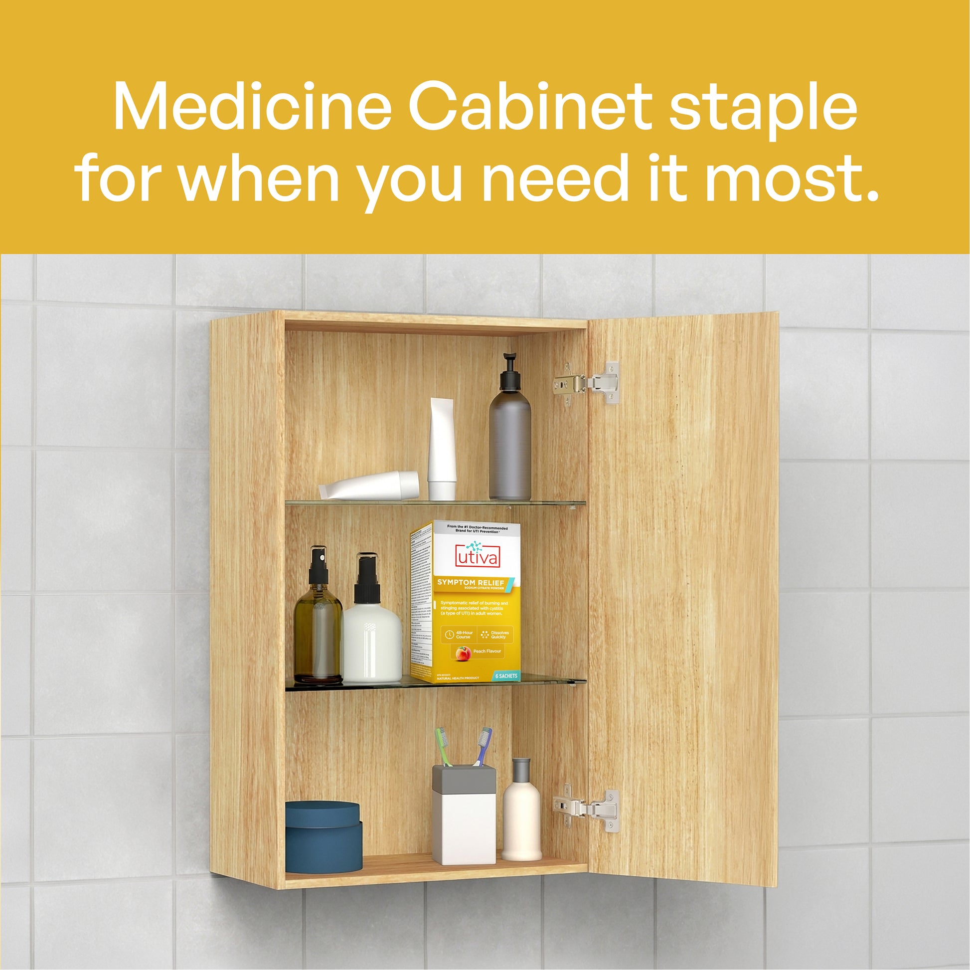 A light wood medicine cabinet with two doors open, showing shelves with toiletries and a box of OTC medicine, set against a tiled wall. A yellow banner at the top reads 'Medicine Cabinet staple for when you need it most.